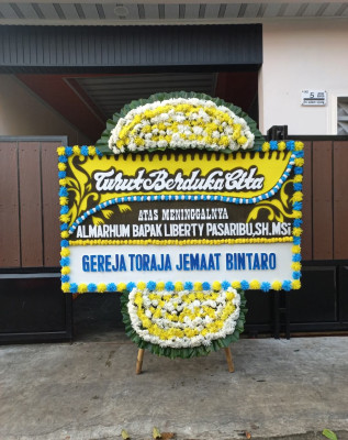 Papan Bunga Duka di Pucuk