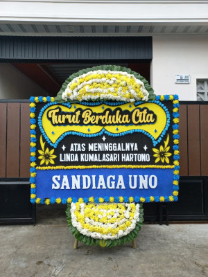 Papan Bunga Duka di Pucuk